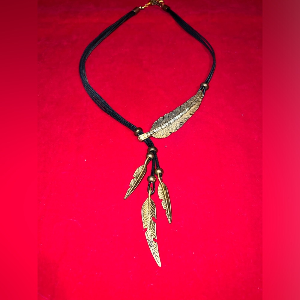 Bohemian style leaf & crystals on a‎ leather cord adjustable size